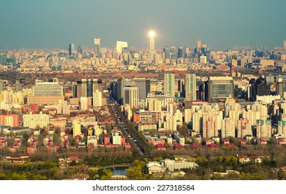 Beijing sunset aerial view with urban buildings.