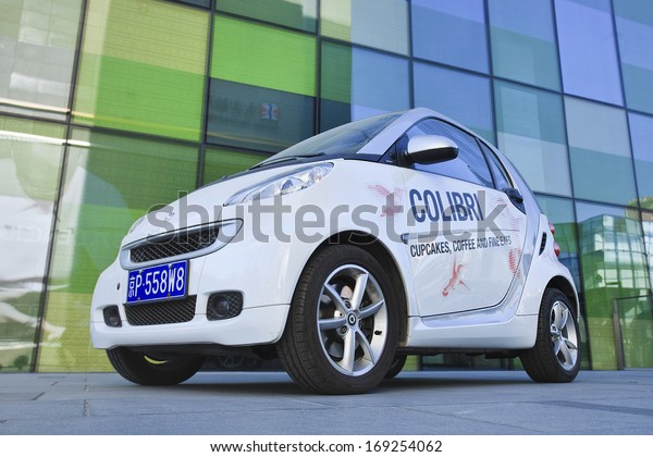 BEIJING-DEC. 12, 2013 Smart Car with advertising. Smart\
Car sales in China grew 45% in 2012 to 15,680 cars. Given the size\
of China\'s automobile market, it\'s still a niche player. Beijing,\
Dec. 12, 2013 