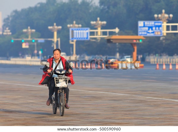 BEIJING-JUNE 1, 2013.\
Middle aged man on his electric bike in the early morning. In just\
a decade, the number of electric-bike riders in China went from\
near zero to over 150\
million.