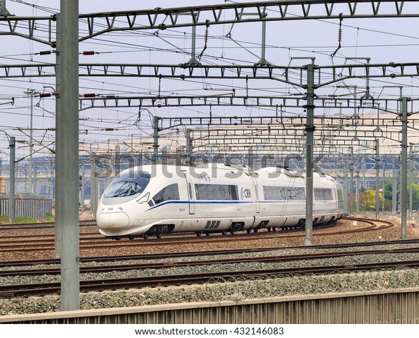 BEIJING-JUNE 5, 2016. Bullet train departs from\
Beijing South Railway Station. China boasts the world\'s biggest\
high-speed railway network. Currently, its total operating length\
had reached 19,000\
km.