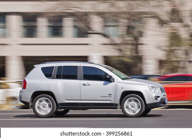 BEIJING-MARCH 30, 2016. Jeep Compass on the road. American brand Chrysler planned to increase its Jeep dealerships in China by about a third and will start local production of Cherokee SUV in 2016.