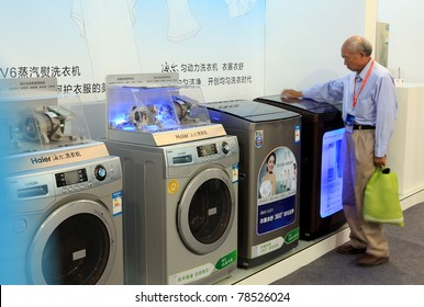 BEIJING-MAY20:A Man Takes A Look At Innovative Home Appliances During The 14th China Beijing International High-tech Expo(CHITEC) On May20,2011 In Beijing,China.CHITEC Is A Major National Hi-tech Expo