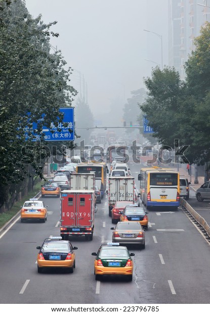 BEIJING-OCT. 11 ,2014. Traffic in smog blanketed\
city center. Pollution in te Chinese capital was that dense that\
its effects are comparable to that of a nuclear winter, Chinese\
scientists have\
said.