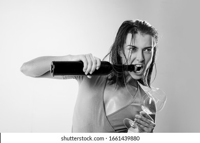 Being A Big Wine Drinker. Adorable Girl Getting Wine Cork Out Of Bottle Without Corkscrew. Pretty Woman Opening Wine Bottle With Teeth. Sensual Wine Addict Holding Wineglass.