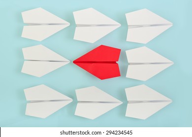 Being Different Concept With Red Paper Plane Going In A Different Direction