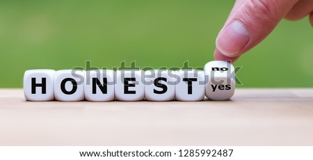 Being honest? Hand turns a dice and changes the word 