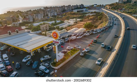 Beirut, Lebanon - July 3 2021: Tens of cars line up near the very few open gas stations in Lebanon. Drivers wait for hours due to fuel shortage.