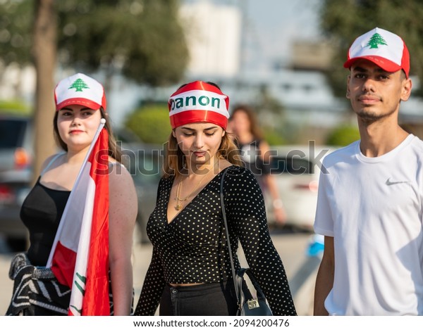 Beirut, Lebanon - October\
27, 2019 - Woman With Lebanese flag Demonstrating against the\
Lebanese Government