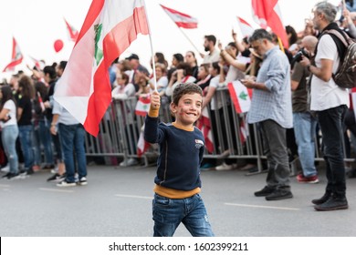 Beirut, Martyrs Square / Lebanon - 22/11/ 2019 :  Independence Day 2019 a Kid Protesting while Holding the Lebanese Flag
