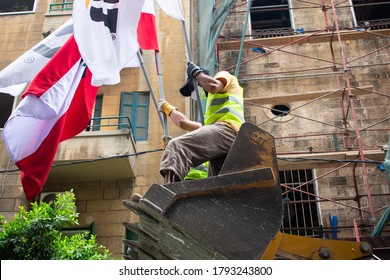 Beirut/Lebanon - 08/09/2020: Rescue Workers On A Backhoe Bucket Waving The National Flag During Disaster Relief Work In Downtown Beirut