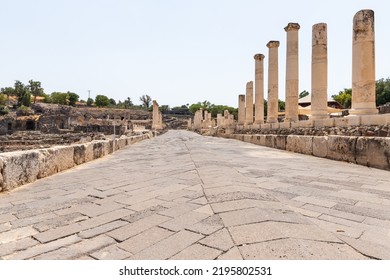 Beit Shean, Israel, August 06, 2022 : Stone pavement on the main street in  ruins of one of the cities of the Decapolis - the ancient Hellenistic city of Scythopolis near Beit Shean city, Israel