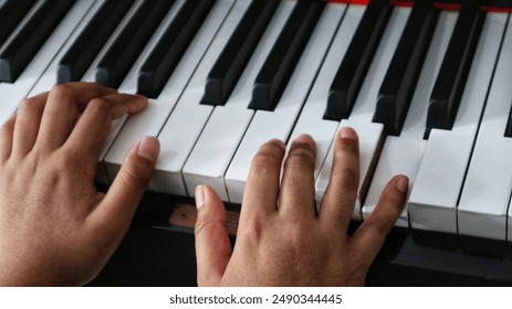 Bekasi, Indonesia, 13 July 2024 - Playing piano in the morning to welcoming the beautiful day. - Powered by Shutterstock