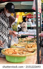 Bekasi, Indonesia - April 15, 2022: Local Muslim People Sell Iftar’s Halal Fried Foods From Roadside Stall At Street Bazaar During The Fasting Month Of Ramadan In The Year Of Outbreak Corona Virus.