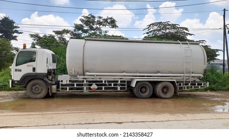 Bekasi, Indonesia - April 2022 : Chemical Liquid Transport Truck Side View From A Distance. Background Concept Of Transport, Transportation, Industry, Industrial,work, Worker,cargo,logistics,shipping