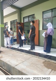 Bekasi, Indonesia, August 20, 2021: Asian Junior High School Student In Medical Face Mask Queuing At School For Getting Vaccinated Against Coronavirus From Doctor Or Nurse.