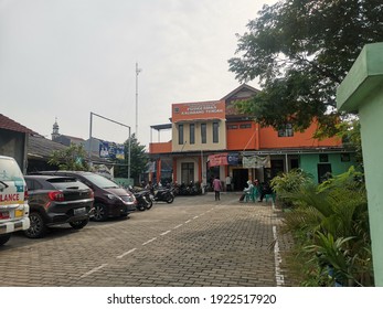 Bekasi, Indonesia - February 23, 2021: Puskesmas Building With Many Vehicles Parked In Front Of It