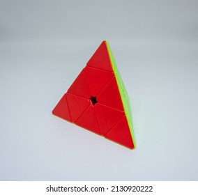 Bekasi, Indonesia - February 26, 2022 : A Pyramid Rubik's Cube Or Called As Pyraminx In An Isolated White Background