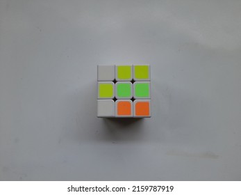 Bekasi, Indonesia - May 2022 : Rubiks Educational Game Seen From Above On A White Background. Background Puzzle Concept, Education, Cube, Hand Cube,train Intelligence,lifestyle,hobby,hobbies,symbol