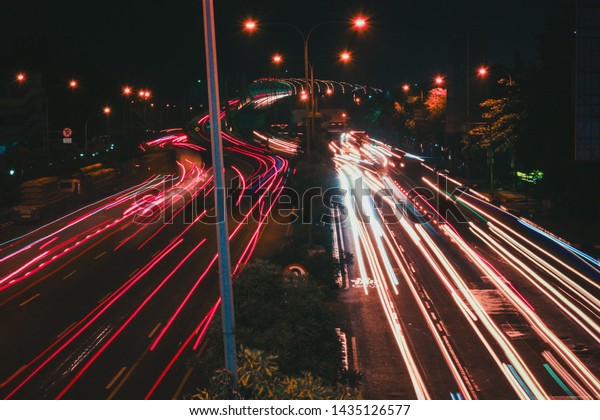 Bekasi, West java /\
Indonesia - (19/06/2019): Night view on the main road in the city\
of Bekasi, West Java