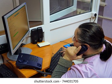 Belarus, Bobruisk, November 09, 2015: Woman - An Ambulance Operator In A Control Room At A Station, Accepting A Call By Phone