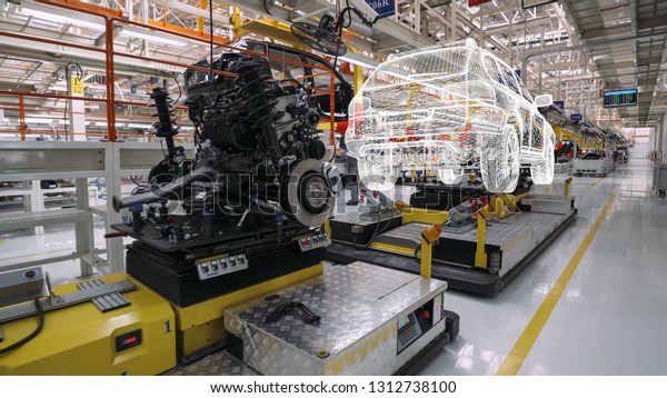 BELARUS, BORISOV - OCTOBER 19, 2017: Automobile\
plant, view of hologram projections of cars and power units, motion\
graphics in modern production of cars, car model visualization,\
assembly line.