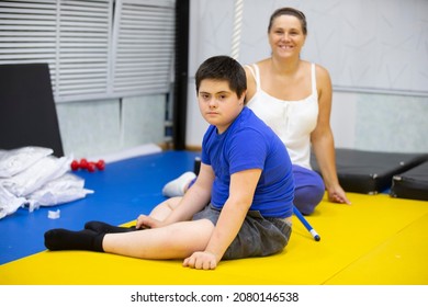 Belarus, The City Of Gomel, June 23, 2021. Judo Club. A Child With Down Syndrome In The Gym Against The Background Of Mom.