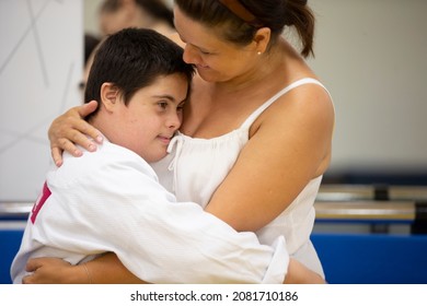 Belarus, The City Of Gomel, June 23, 2021. Judo Club. Mom Hugs The Child With Down Syndrome.