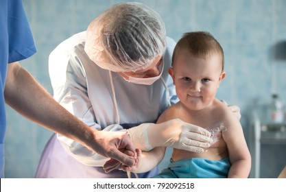 Belarus, The City Of Gomel.City Burn Hospital.June 02, 2017.To A Little Boy, A Nurse Heals A Burn.Kid In The Hospital Wounded.The Doctor Heals A Little Bit.The Boy Was Burned.Little Hospital Patient