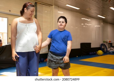 Belarus, The City Of Gomil, June 23, 2021. Judo Club. Mom And Son With Down Syndrome In The Gym.