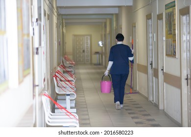 Belarus, The City Of Gomil. May 31, 2021. Central Hospital.A Cleaning Lady Is Walking Along The Corridor Of A Hospital Or Clinic.