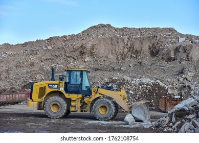 BELARUS - JUNE 16, 2020: Wheel Loader Caterpillar 950 GC (CAT) At Landfill. Recycling And Disposal Of Construction Waste And Concrete Crushing. Heavy Machinery In Mining Quarry.