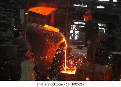 Belarus, Minsk, 2014. Work In The Foundry. Molten Metal Worker At A Metallurgical Plant