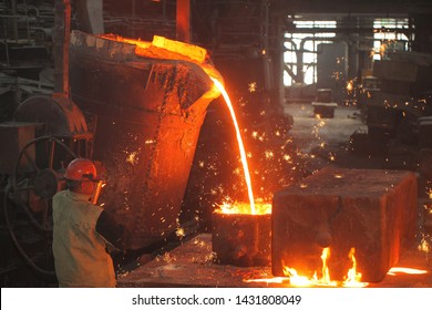 Belarus, Minsk, 2014. Work In The Foundry. Molten Metal Worker At A Metallurgical Plant