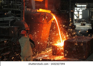 Belarus, Minsk, 2014. Work In The Foundry. Molten Metal Worker At A Metallurgical Plant