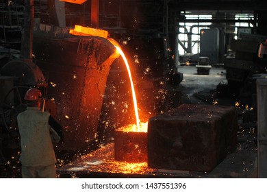 Belarus, Minsk, 2014. Work In The Foundry. Molten Metal Worker At A Metallurgical Plant