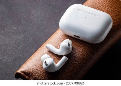 Belarus, Minsk, October 18, 2021 Apple AirPods Pro On A Leather Case. New Airpods Pro With Active Noise Cancellation And Transparency.