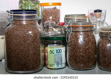 Belarusian Paper Money In A Glass Jar Among Other Jars With Cereals And Dried Fruits. Keeping Money In A Glass Jar. Secret Piggy Bank. Money Saving Concept. Keeping Cash At Home. Financial Reserve.