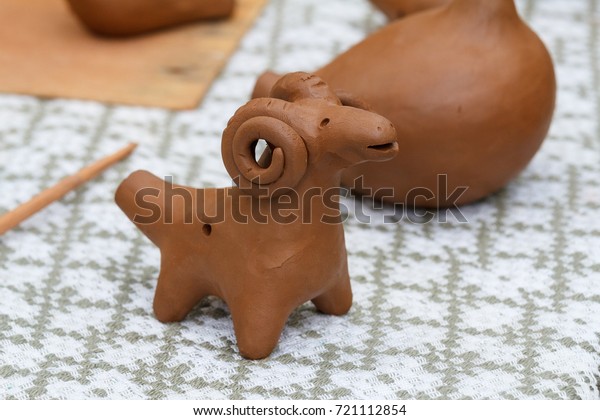 Belarusian traditional clay handmade.\
Clay made toy whistle figure sheep handmade\
craft.