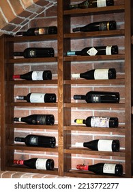 Belarus,Minsk,2022. Interior Of An Italian Cafe Restaurant Da Claudio. Wine Cabinet Or Cellar With Presentation Of Bottles Of Various Wines In A Store Or Restaurant