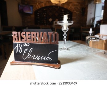 Belarus,Minsk,2022. Interior Of An Italian Cafe Restaurant Da Claudio. Reserved Table Decoration In The Empty Cafe Hall.