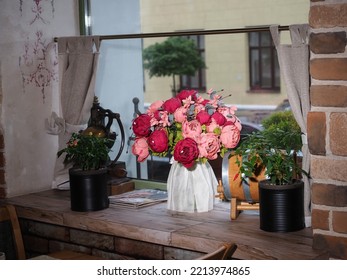 Belarus,Minsk,2022. Interior Of An Italian Cafe Restaurant Da Claudio. Vase With Flowers On The Windowsill In A Cafe For Decor