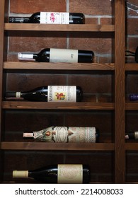 Belarus,Minsk,2022. Interior Of An Italian Cafe Restaurant Da Claudio. Wine Cabinet Or Cellar With Presentation Of Bottles Of Various Wines In A Store Or Restaurant