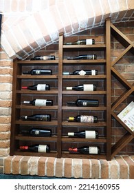 Belarus,Minsk,2022. Interior Of An Italian Cafe Restaurant Da Claudio. Wine Cabinet Or Cellar With Presentation Of Bottles Of Various Wines In A Store Or Restaurant