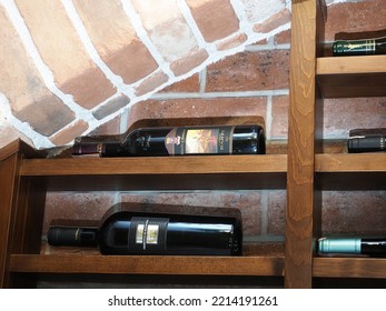 Belarus,Minsk,2022. Interior Of An Italian Cafe Restaurant Da Claudio. Wine Cabinet Or Cellar With Presentation Of Bottles Of Various Wines In A Store Or Restaurant