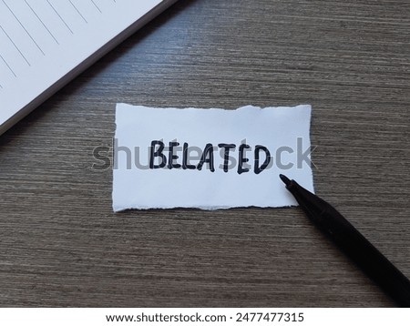 Belated writting on table background.