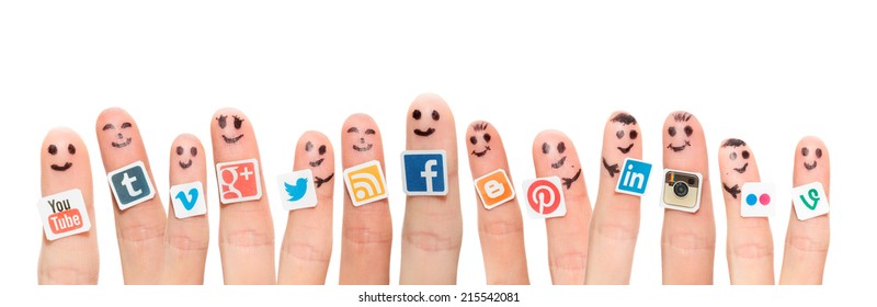 BELCHATOW, POLAND - AUGUST 31, 2014: Happy group of finger smileys with popular social media logos printed on paper and stuck to the fingers.
