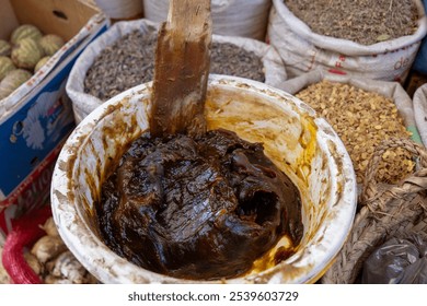 Beldi black soap is an exfoliating paste of exceptional quality, made with black olives and argan oil. Hammam ritual, Marrakech, Morocco.