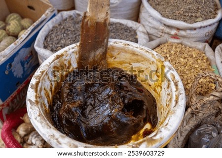 Beldi black soap is an exfoliating paste of exceptional quality, made with black olives and argan oil. Hammam ritual, Marrakech, Morocco.