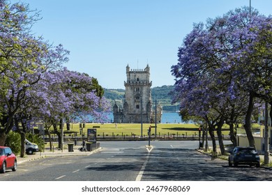 Belem Tower and Jacaranda Blooming Purple Blue Trees on Sunny Day. Lisbon, Portugal. - Powered by Shutterstock