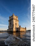 Belem Tower or Tower of St Vincent - famous tourist landmark of Lisboa and tourism attraction - on the bank of the Tagus River Tejo on sunset. Lisbon, Portugal